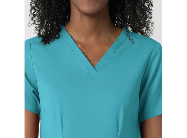 Thrive Dametunika med frontlommer Teal Blue S 