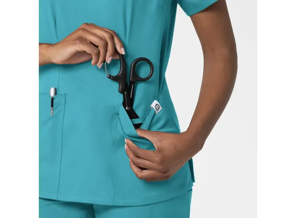 Thrive Dametunika med frontlommer Teal Blue S 
